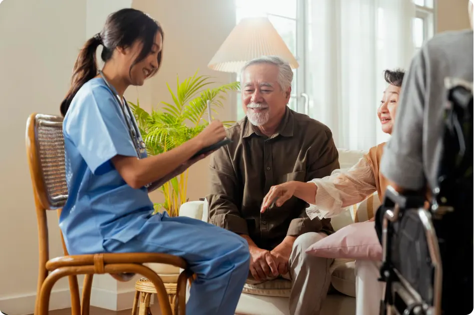 Carewell care professional chatting with an older man at home
